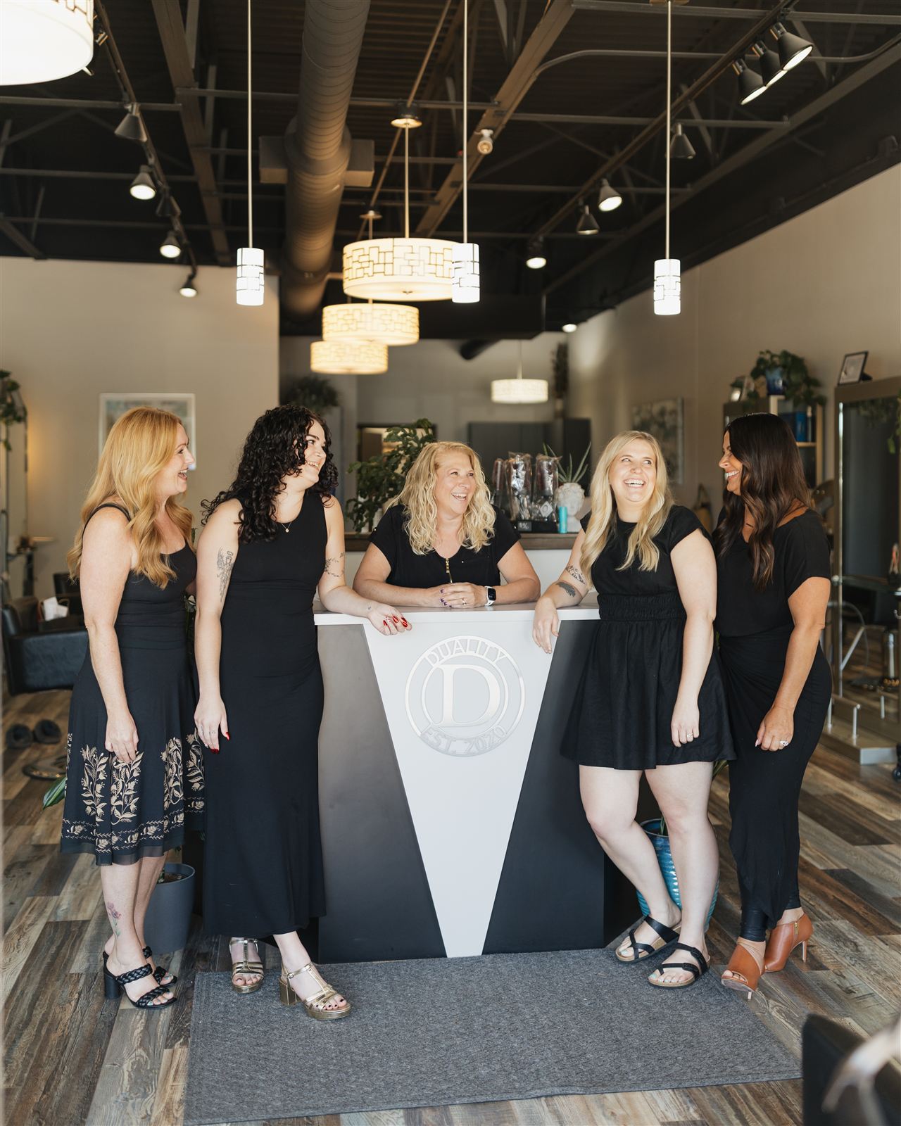 Duality Salon stylists at the reception desk in Williamsville